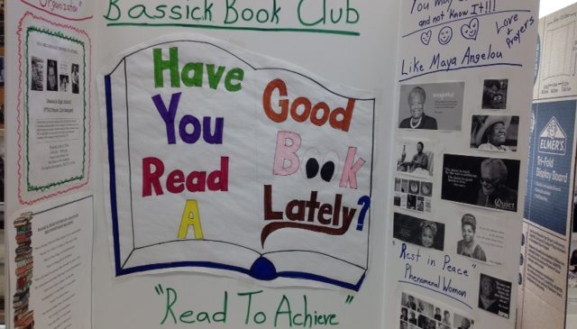 A board reading "Have you read a good book lately?" at the Bassick High School Book Fair