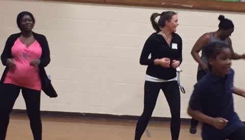 O'Brien Teacher Leader Molly Waszkelewicz joins students and parents in hip hop dance moves