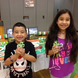 Multicultural Night at John Barry Elementary School: Students posing with four leaf clovers from the Ireland table