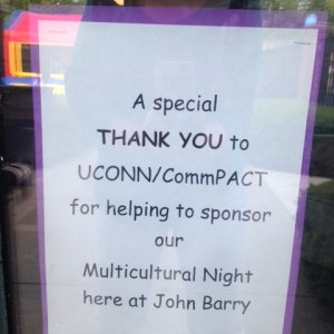 Note in a window reading "A Special Thank You to UCONN/CommPACT for helping to sponsor our Multicultural Night here at John Barry"